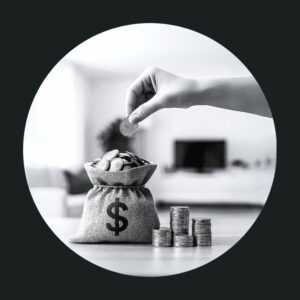 Hand holding a dollar coin above a bag of money.